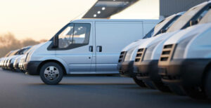 Delivery vans standing out from a fleet of white vans. Express delivery and shipment service concept. 3d rendering